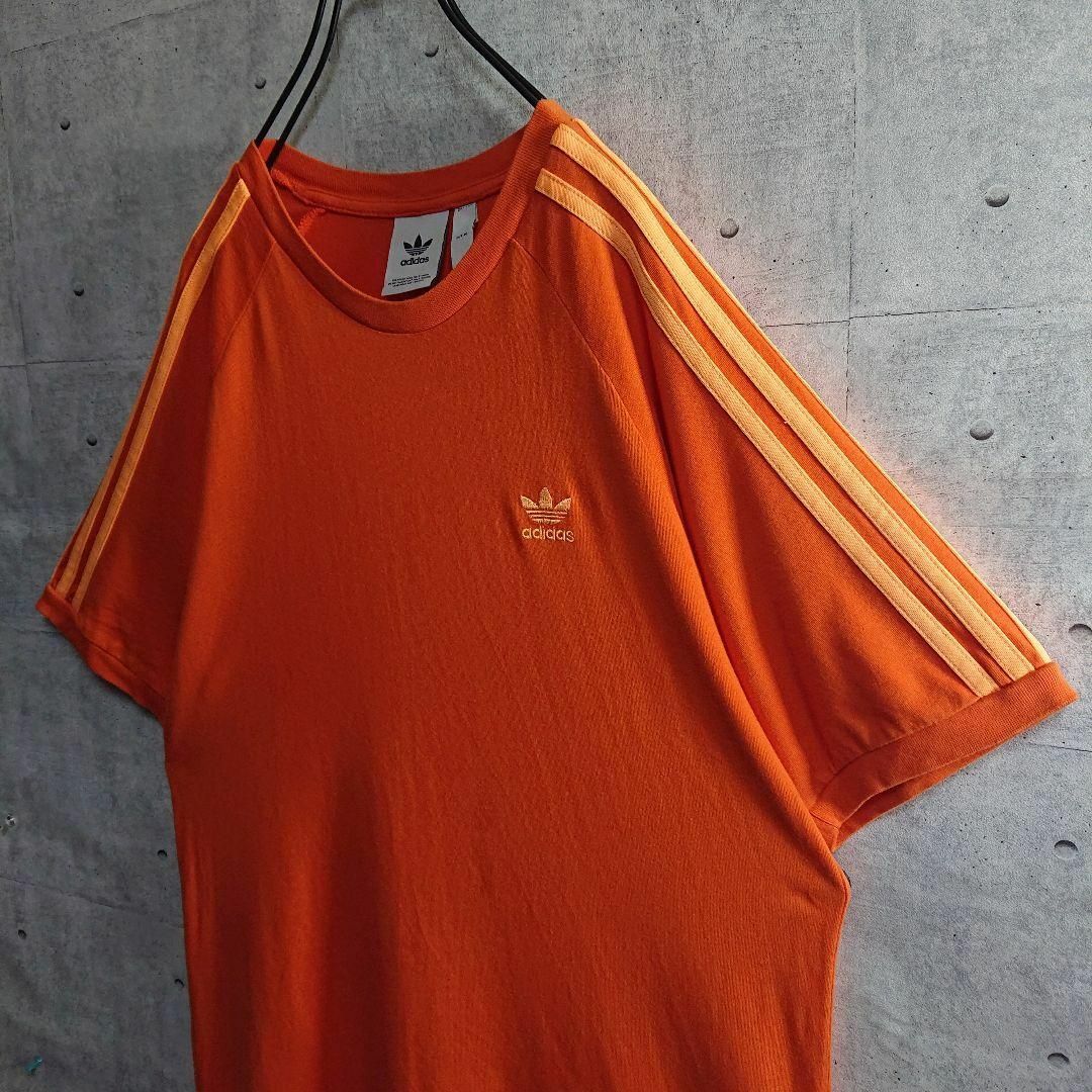 adidas(アディダス)の【adidas】大人気 トレフォイル 刺繍ロゴ 3本ライン Tシャツ 橙 M メンズのトップス(Tシャツ/カットソー(半袖/袖なし))の商品写真