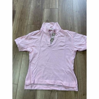 ユニクロ(UNIQLO)のピンク　ショート丈ポロシャツ　サイズM 美品(ポロシャツ)