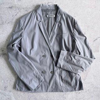 ジルサンダー(Jil Sander)の【JIL SANDER】薄手コットン ダブル ジャケット グレー ジルサンダー.(テーラードジャケット)