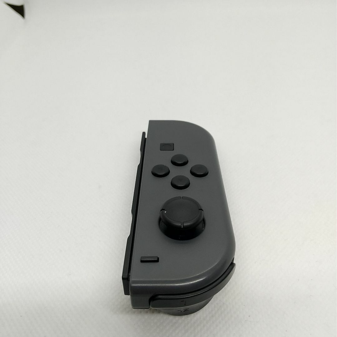 Nintendo Switch(ニンテンドースイッチ)の【廃盤】⑨Switch ジョイコン　グレー　左のみ(L)【任天堂純正品】灰色黒色 エンタメ/ホビーのゲームソフト/ゲーム機本体(家庭用ゲーム機本体)の商品写真