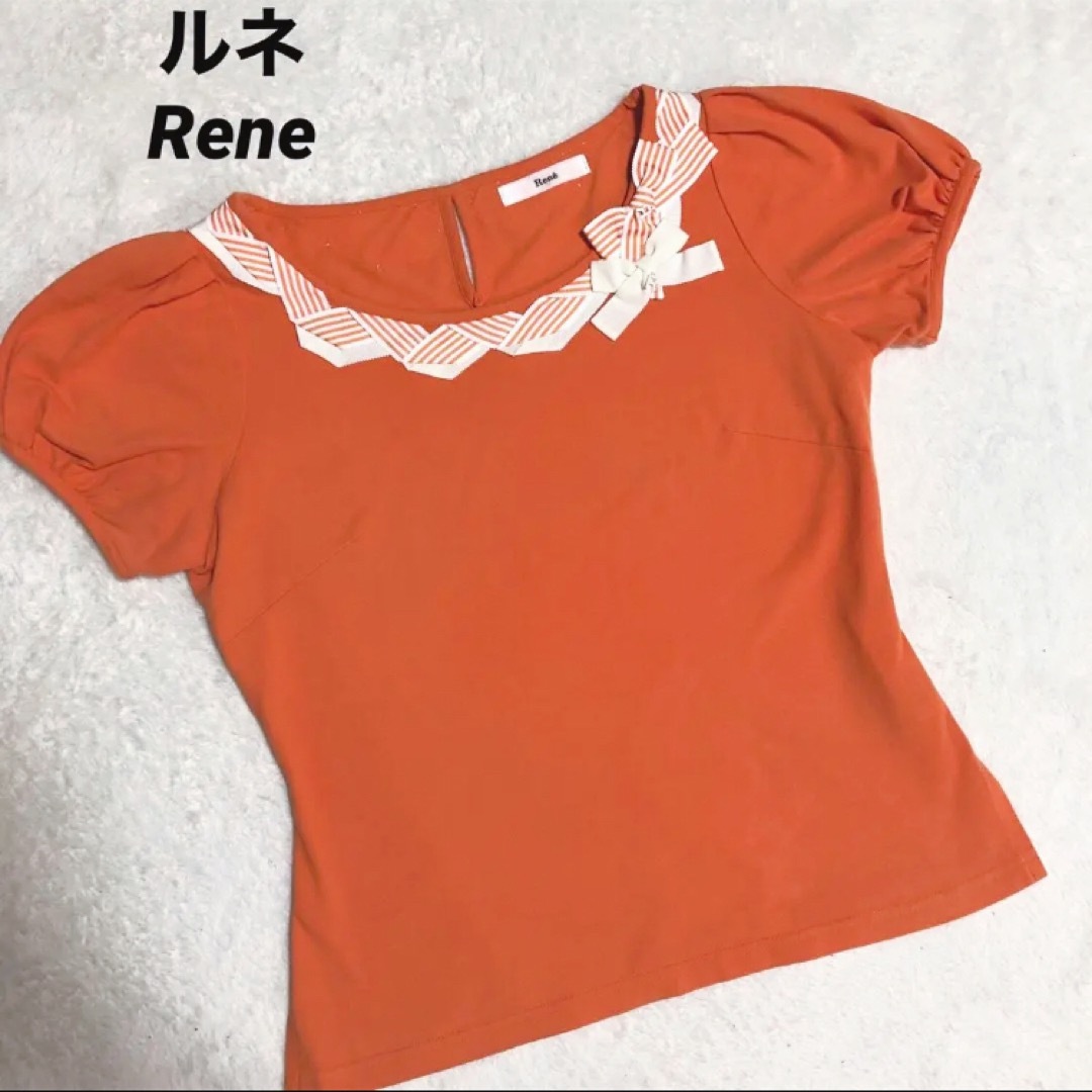 René(ルネ)のルネ　Rene トップス　オレンジ　半袖カットソー　ブランドプレート レディースのトップス(シャツ/ブラウス(半袖/袖なし))の商品写真