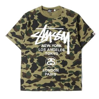 アベイシングエイプ(A BATHING APE)のA BATHING APE ア ベイシング エイプ Tシャツ サイズ:M STUSSY コラボ 30周年記念 1stカモ 猿迷彩 ワールドツアー 半袖 クルーネック グリーンカモ トップス カットソー ストリート カジュアル ブランド【メンズ】【中古】【美品】(Tシャツ/カットソー(半袖/袖なし))