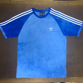 オリジナルス(Originals（adidas）)のアディダス×ファレルウィリアムズ Tシャツ Lサイズ 青(Tシャツ/カットソー(半袖/袖なし))