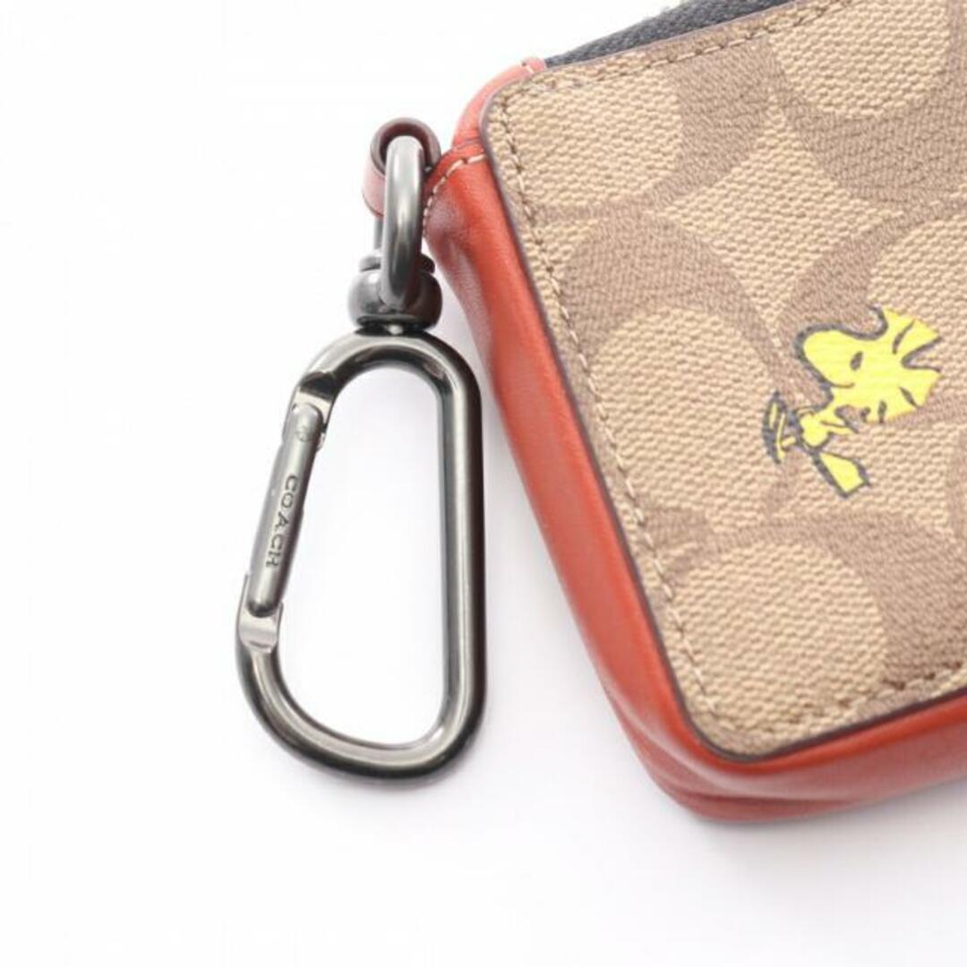 COACH(コーチ)のCOACH × PEANUTS スヌーピー Lジップ シグネチャー カードケース PVC レザー ブラウン レッドブラウン マルチカラー レディースのファッション小物(その他)の商品写真