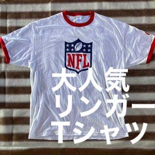 大人気企業物NFLネスレリンガーTシャツ アメリカ古着USA(Tシャツ/カットソー(半袖/袖なし))