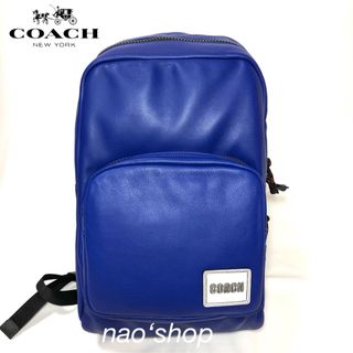 コーチ(COACH)の【新品】COACH メンズ トール バックパック パッチ ブルー(バッグパック/リュック)