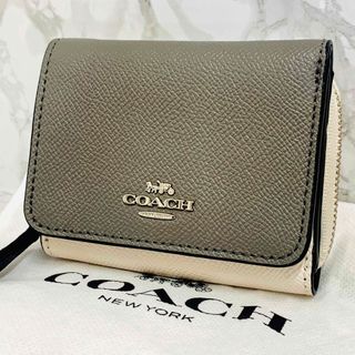 コーチ(COACH)のコーチ　二つ折り　ミニ財布　✨新品未使用 保存袋 説明書付き✨　グレー×ホワイト(財布)