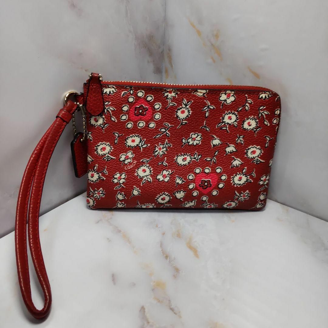 COACH(コーチ)のCOACH コーチ リストポーチ ワイルドハート レッド マルチ 花柄 レディースのバッグ(その他)の商品写真