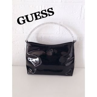 ゲス(GUESS)のGUESS エナメル　バンド　バッグ ブラック(ハンドバッグ)