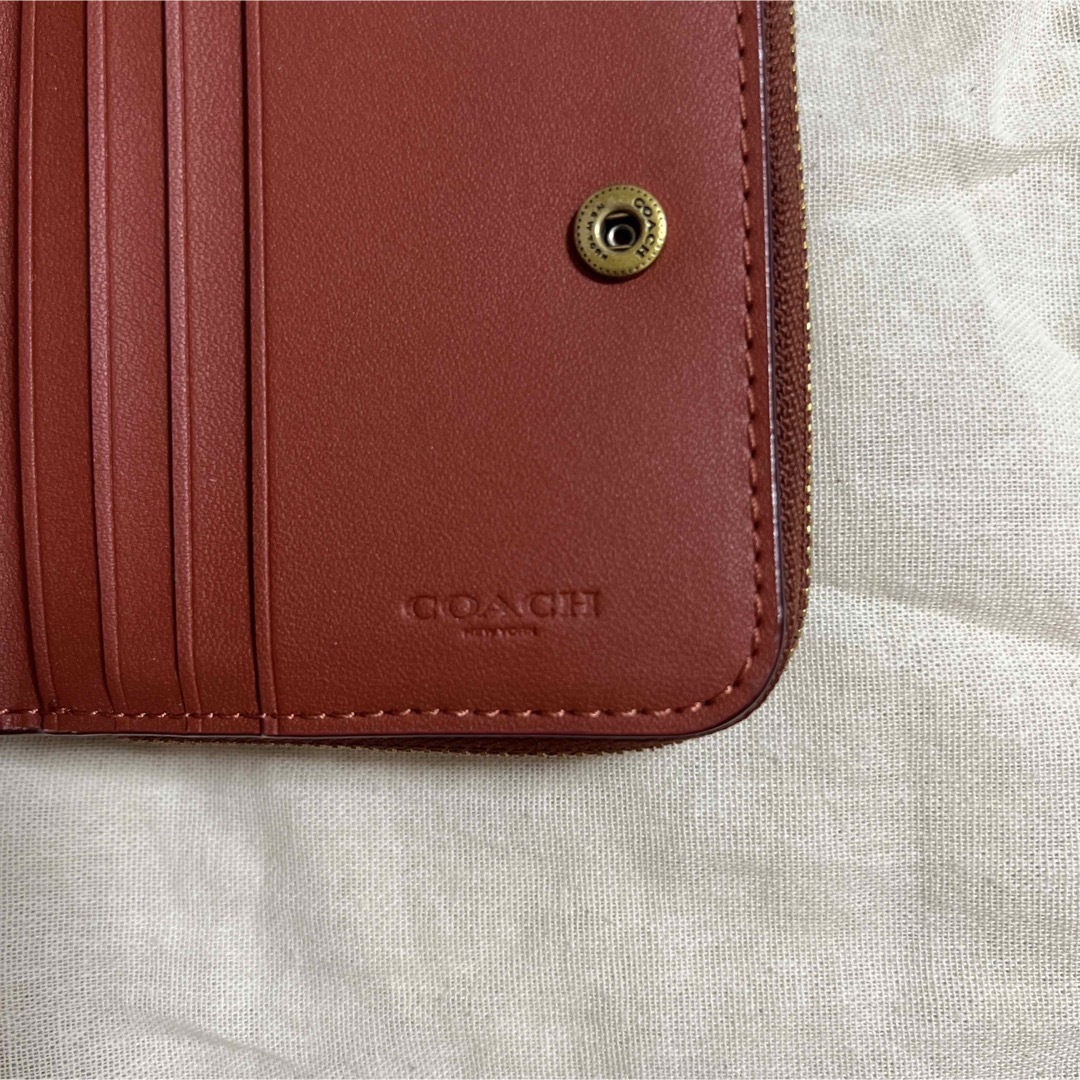 COACH(コーチ)の値下げ中！コーチ　C6027 シグネチャー柄　二つ折り財布　ビルフォールド レディースのファッション小物(財布)の商品写真