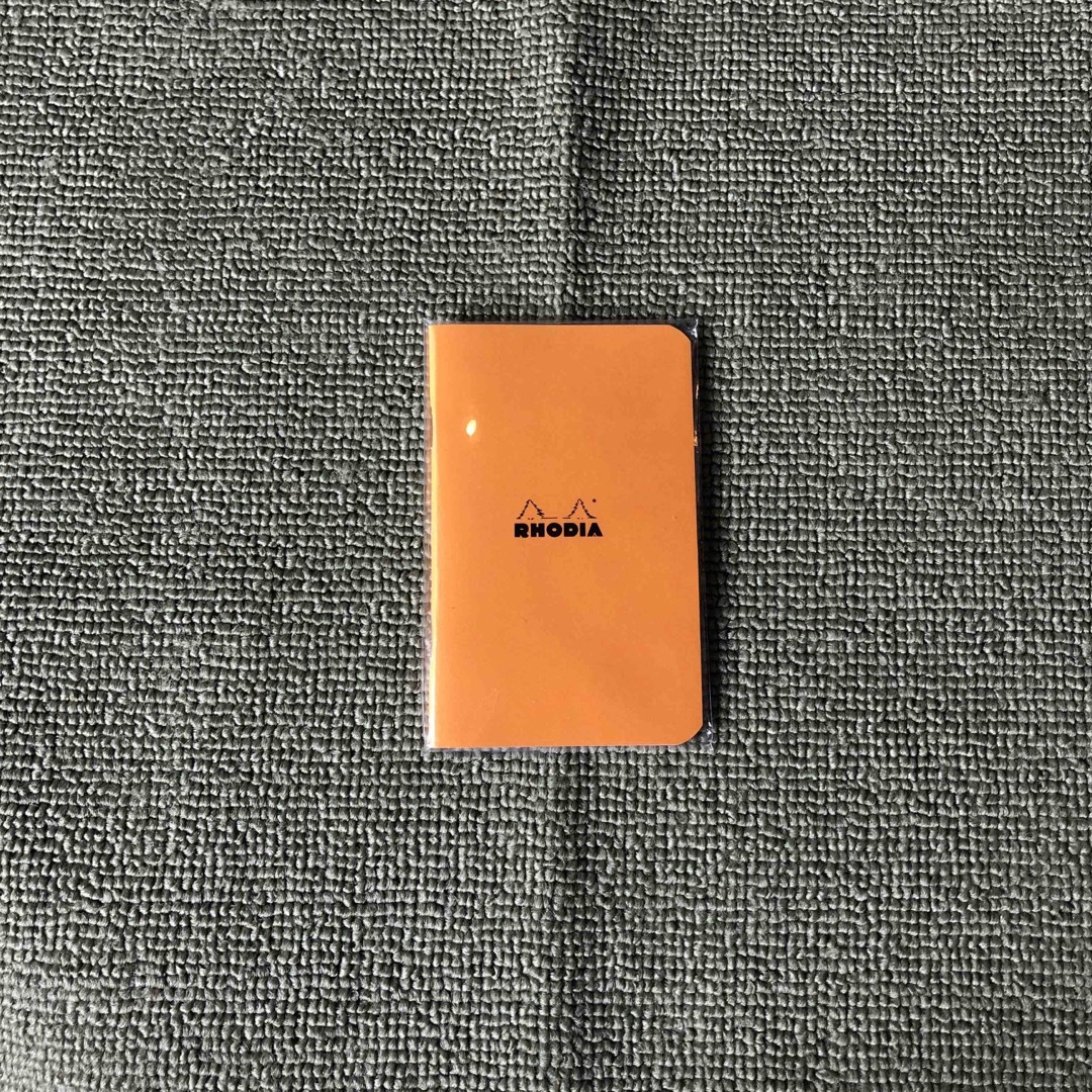 RHODIA(ロディア)の→新品〒【管理No.1902】ロディア Stapled手帳 オレンジ 1つ インテリア/住まい/日用品の文房具(ノート/メモ帳/ふせん)の商品写真