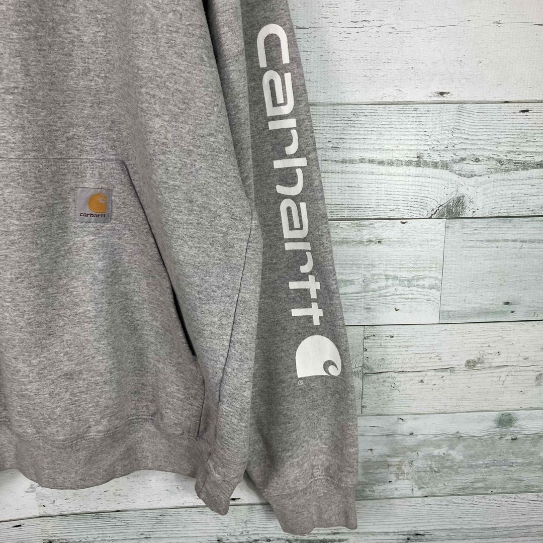 希少 CARHARTT プルオーバーパーカー メキシコ製 袖ロゴ 奇抜柄