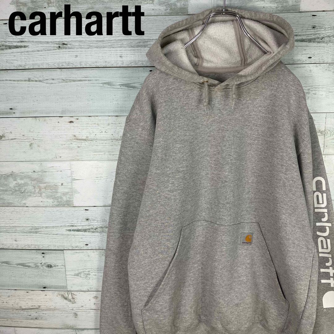 希少 CARHARTT プルオーバーパーカー メキシコ製 袖ロゴ 奇抜柄