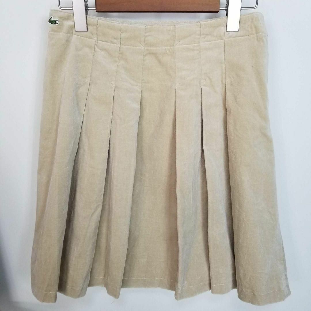 LACOSTE(ラコステ)のLACOSTEフロントタックプリーツデザインベロアスカートMベージュ レディースのスカート(ひざ丈スカート)の商品写真