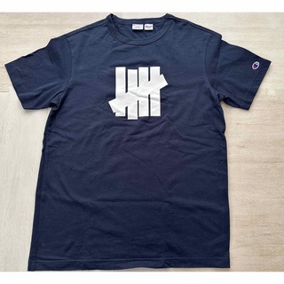 アンディフィーテッド(UNDEFEATED)のUNDEFEATED CHAMPION コラボ Tシャツ L(Tシャツ/カットソー(半袖/袖なし))