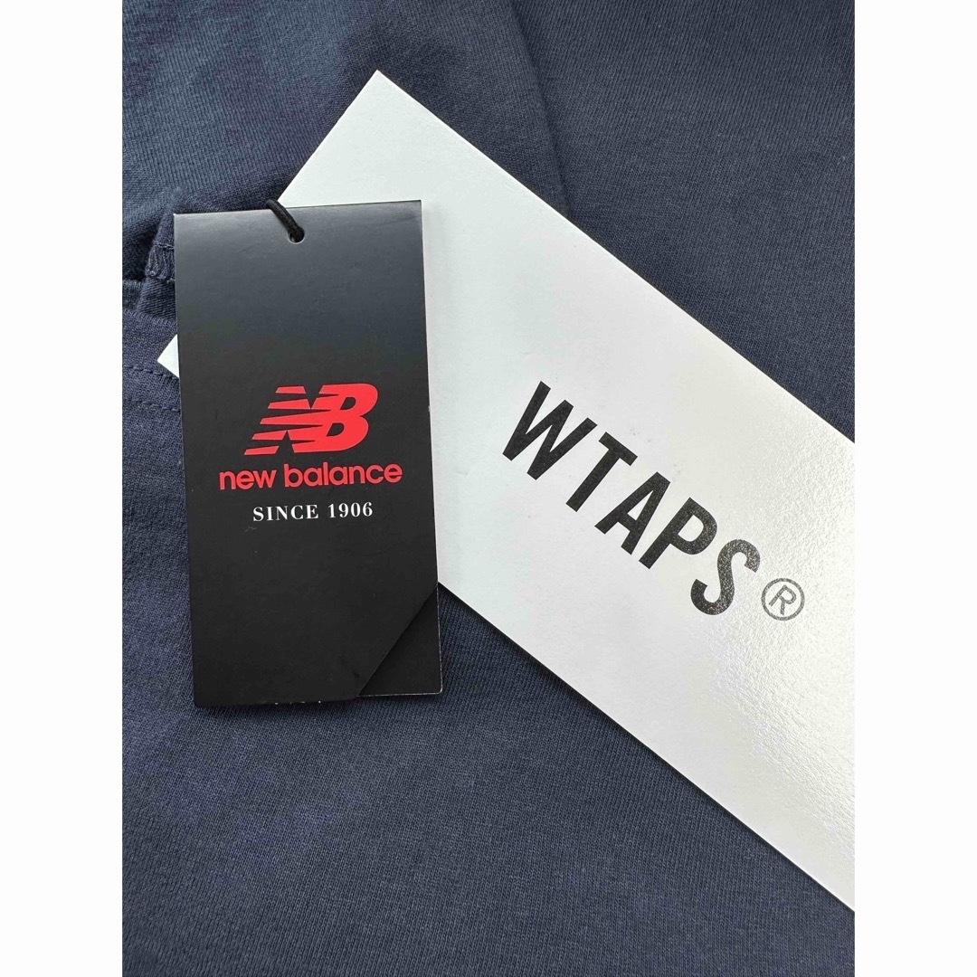 W)taps(ダブルタップス)の美品　タグ付き　wtaps new balance Tシャツ　ネイビー　Sサイズ メンズのトップス(Tシャツ/カットソー(七分/長袖))の商品写真