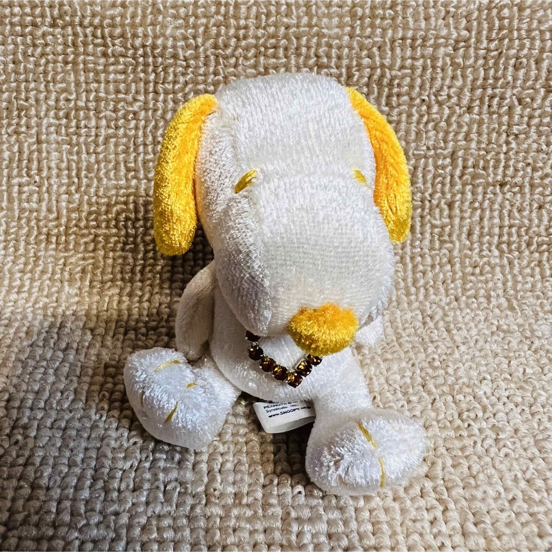 SNOOPY(スヌーピー)の【新品】SNOOPY BIRTHSTONE.11 Nov トパーズ エンタメ/ホビーのおもちゃ/ぬいぐるみ(キャラクターグッズ)の商品写真