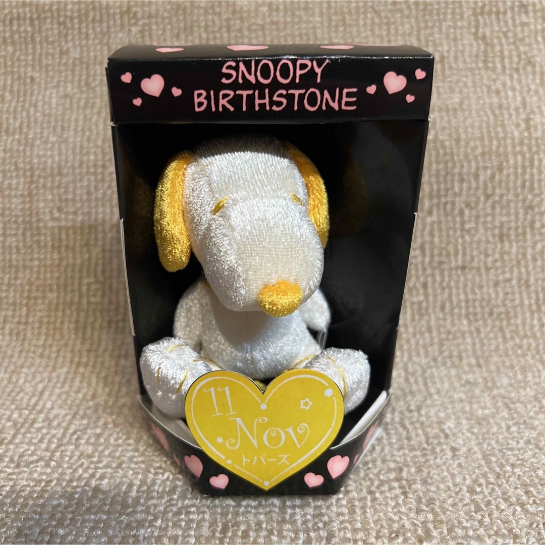 SNOOPY(スヌーピー)の【新品】SNOOPY BIRTHSTONE.11 Nov トパーズ エンタメ/ホビーのおもちゃ/ぬいぐるみ(キャラクターグッズ)の商品写真