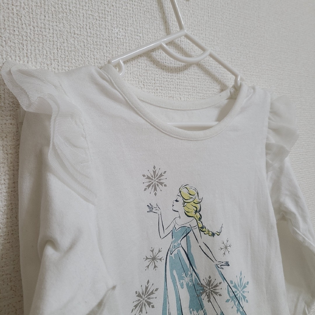 アナと雪の女王(アナトユキノジョオウ)のエルサ 110 肩フリル 長袖Tシャツ キッズ/ベビー/マタニティのキッズ服女の子用(90cm~)(Tシャツ/カットソー)の商品写真
