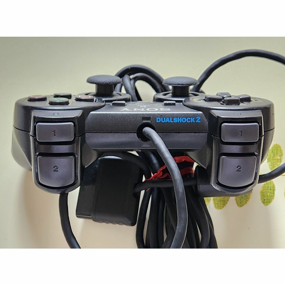 PlayStation2(プレイステーション2)のPS2コントローラー 純正品 ブラック　２個セット エンタメ/ホビーのゲームソフト/ゲーム機本体(家庭用ゲーム機本体)の商品写真
