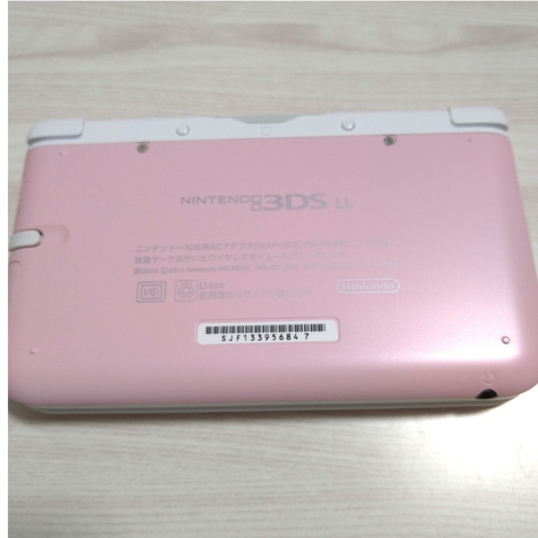 ニンテンドー3DS(ニンテンドー3DS)のNintendo 3DS  LL 本体ピンク/ホワイト　ジャンク エンタメ/ホビーのゲームソフト/ゲーム機本体(携帯用ゲーム機本体)の商品写真
