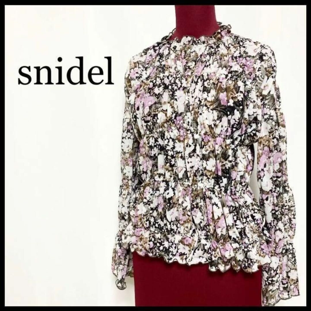 SNIDEL(スナイデル)のスナイデル オーガンジー ブラウス 長袖 シフォン ティアード 花柄 紫 レディースのトップス(シャツ/ブラウス(長袖/七分))の商品写真