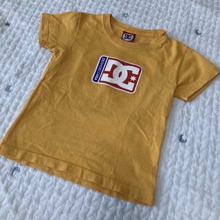 ディーシー(DC)のDC プリント Tシャツ 黄色 オレンジ S(Tシャツ/カットソー)
