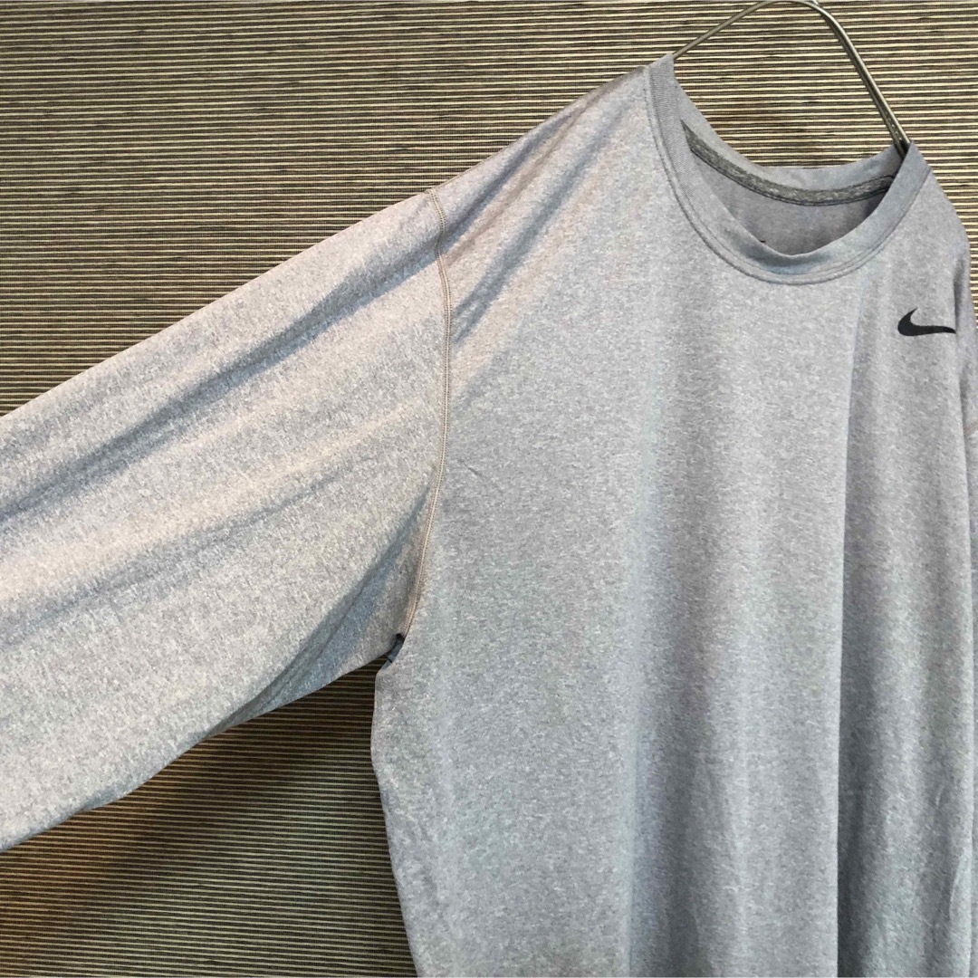 NIKE(ナイキ)の【ナイキ】ロンT　スウォッシュロゴ　ワンポイントロゴ　グレー　メキシコ製74 メンズのトップス(Tシャツ/カットソー(七分/長袖))の商品写真