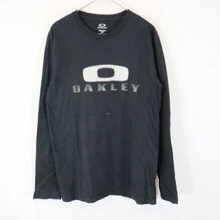 オークリー(Oakley)のOAKLEY オークリー 英文字 ロゴプリント 長袖Ｔシャツ ブラック (メンズ Ｓ) 中古 古着 N8471(Tシャツ/カットソー(七分/長袖))