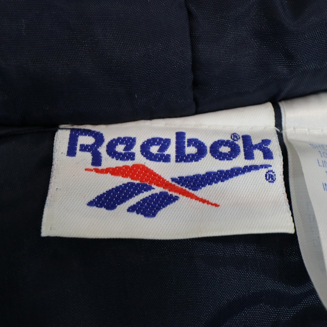 Reebok(リーボック)の90年代 Reebok リーボック 中綿ナイロン ジャケット 防寒 背面刺繍 裏地キルティング フード付き ネイビー (メンズ 2XL) 中古 古着 N8938 メンズのトップス(パーカー)の商品写真