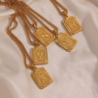 ステューシー(STUSSY)の【spell T gold necklace】#871 18k(ネックレス)