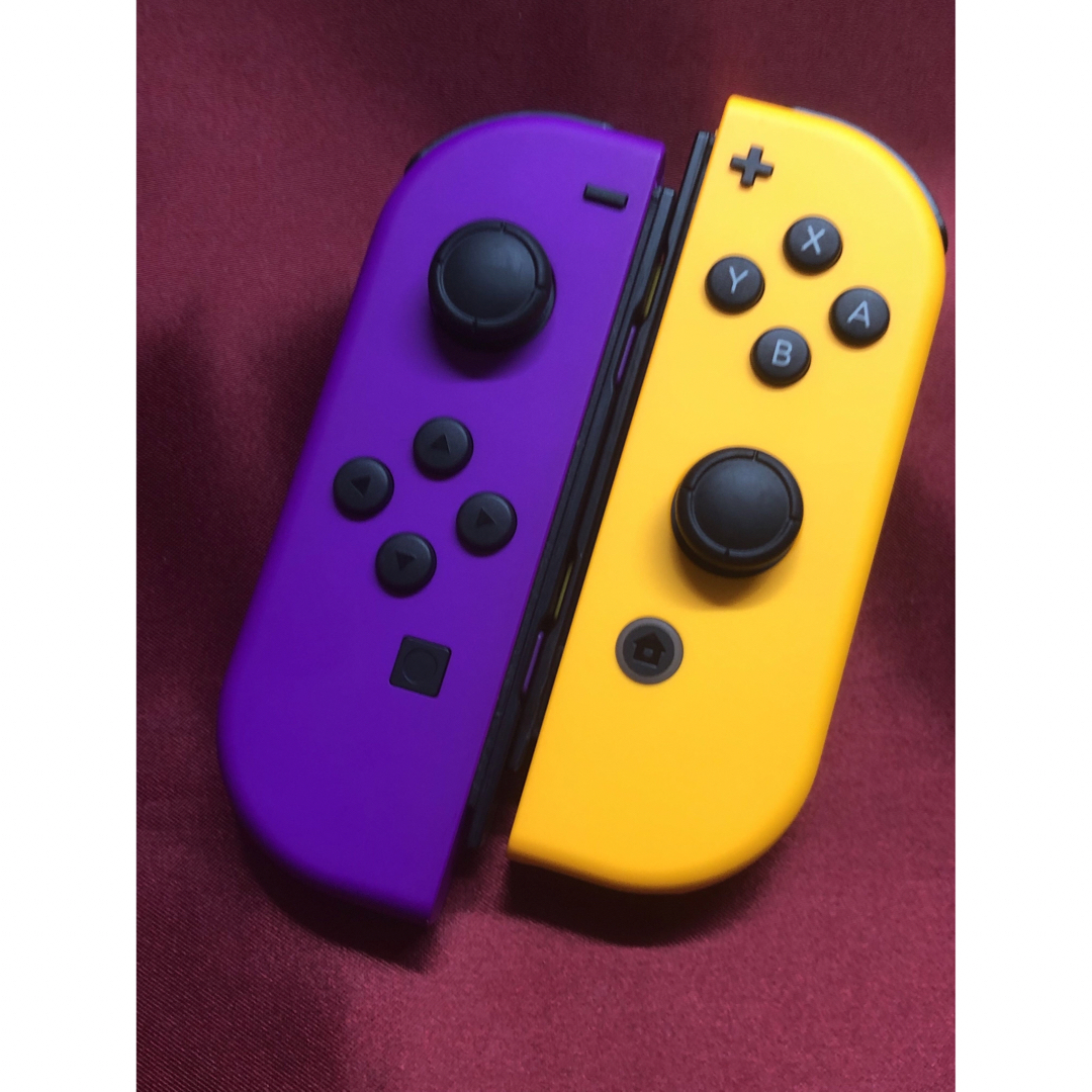 Nintendo Switch(ニンテンドースイッチ)の[安心保証]美品　純正ジョイコン　ネオンパープル Ｌ　ネオンオレンジ Ｒ エンタメ/ホビーのゲームソフト/ゲーム機本体(その他)の商品写真