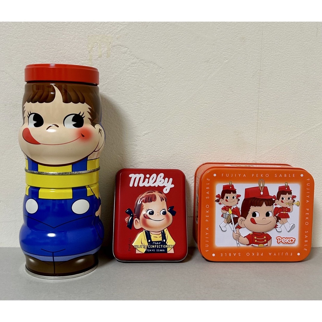 不二家(フジヤ)のペコちゃん缶　3点セット エンタメ/ホビーのおもちゃ/ぬいぐるみ(キャラクターグッズ)の商品写真