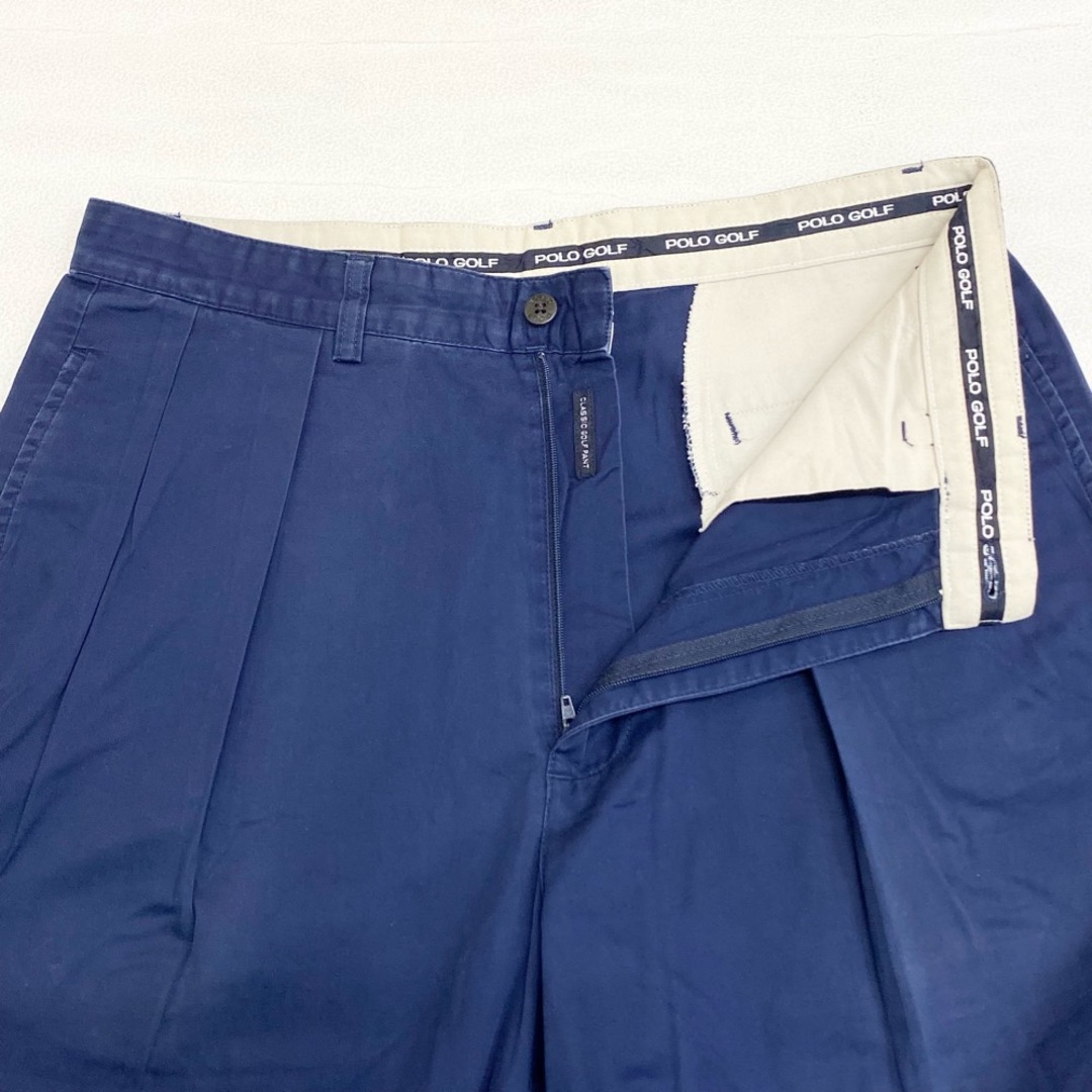 Ralph Lauren(ラルフローレン)の【中古】ポロ ゴルフ POLO GOLF チノパンツ ツータック エンブレム ワッペン サイズ：W33 L31.5 ネイビー メンズのスーツ(スラックス/スーツパンツ)の商品写真