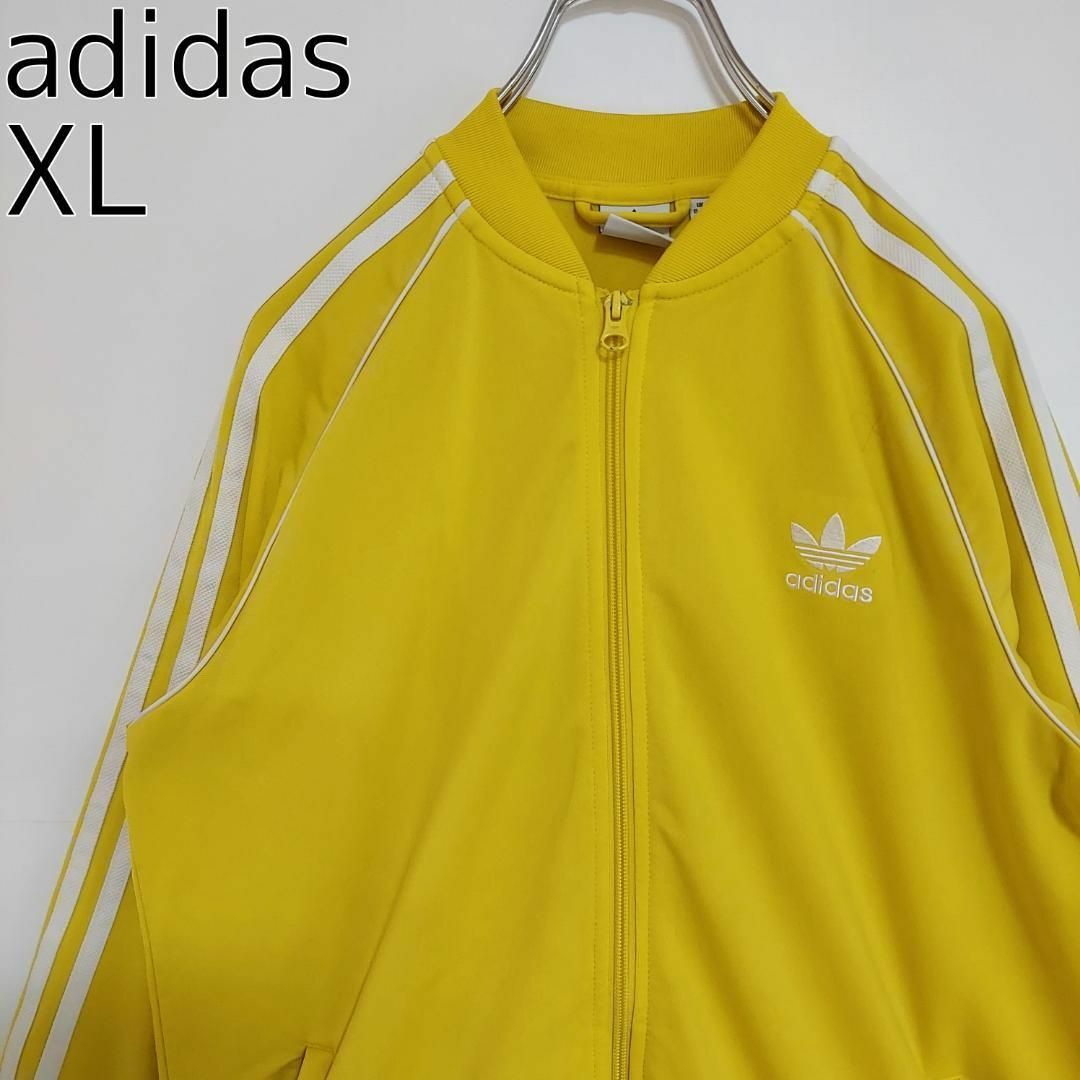 adidas(アディダス)のadidas アディダス トラックジャケット 黄色イエロー 刺繍ワンポイントXL メンズのトップス(ジャージ)の商品写真