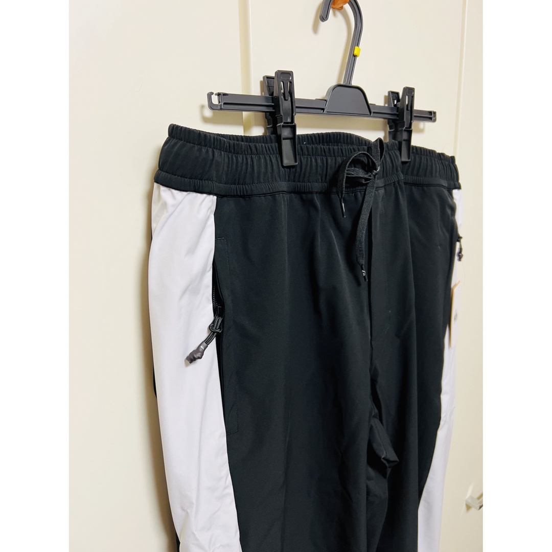 QUIKSILVER(クイックシルバー)の新品　クイックシルバー　サイドライントラックパンツ　ブラック　メンズ　XL メンズのパンツ(その他)の商品写真