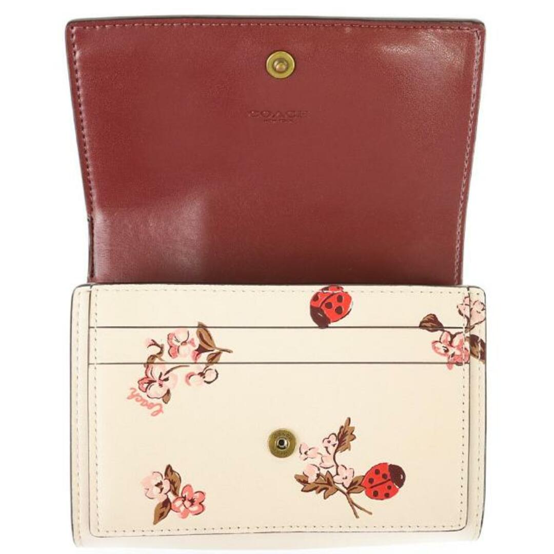 COACH(コーチ)のコーチ 二つ折り財布 コンパクトウォレット フラワー 中古 ピンク系 アイボリー レザー COACH 【中古】 | シンプル てんとう虫 レディース ファッション サイフ ブランド小物 ランクSA レディースのファッション小物(財布)の商品写真