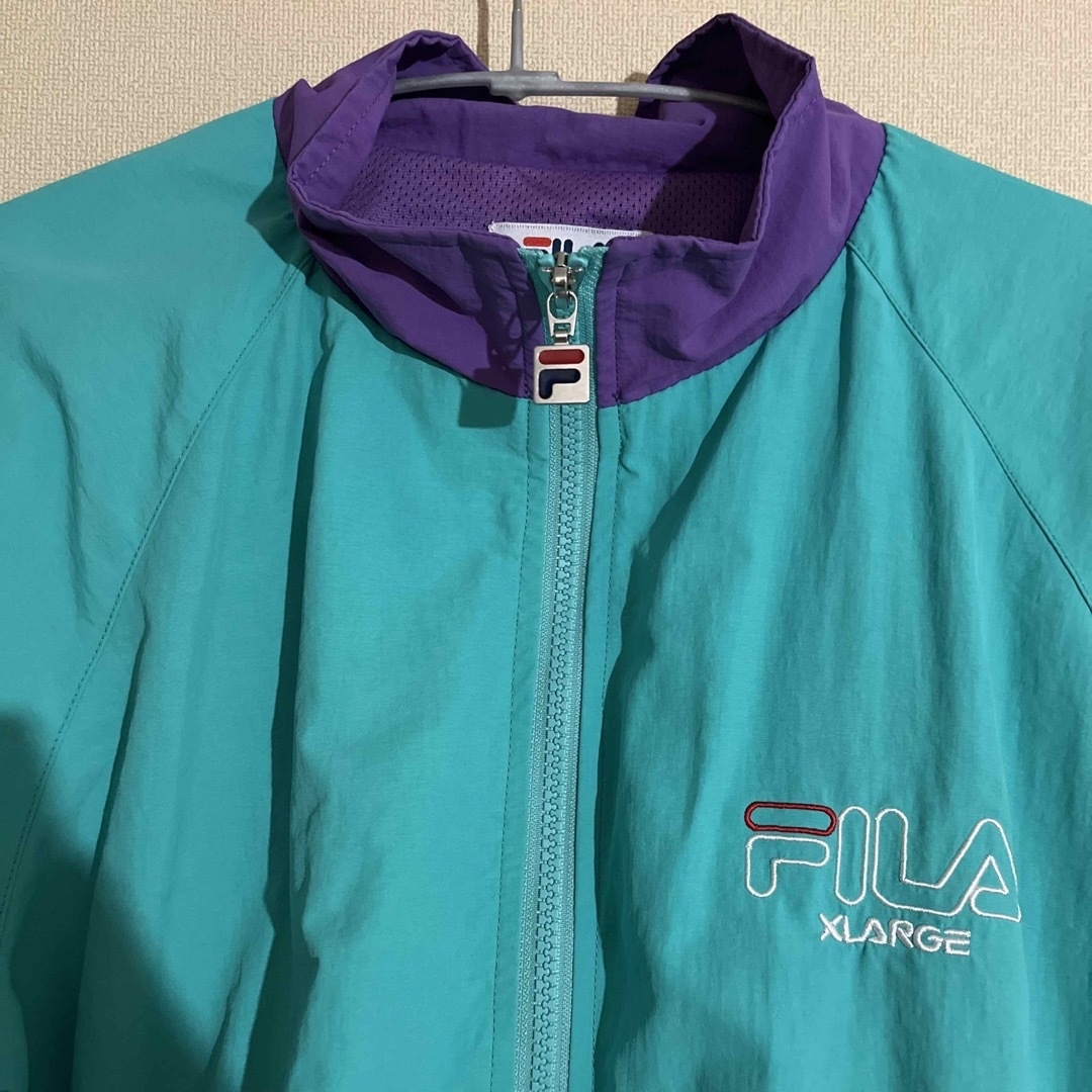 XLARGE(エクストララージ)のFILA×XLARGE  コラボアウター　ナイロンジャケット メンズのジャケット/アウター(ナイロンジャケット)の商品写真