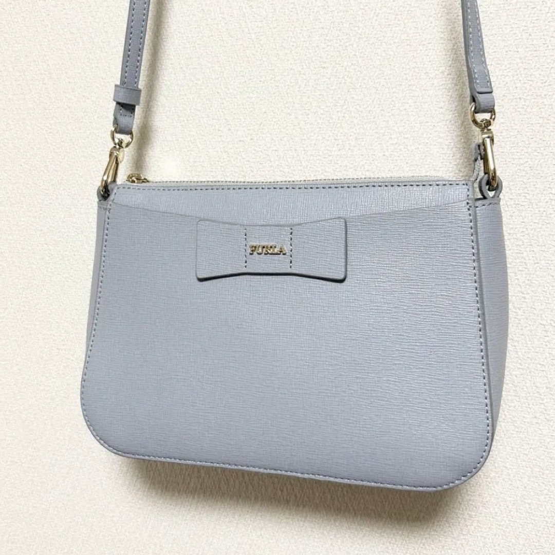 Furla(フルラ)のフルラ クロスリボン 水色 ミニショルダーバッグ レディースのバッグ(ショルダーバッグ)の商品写真