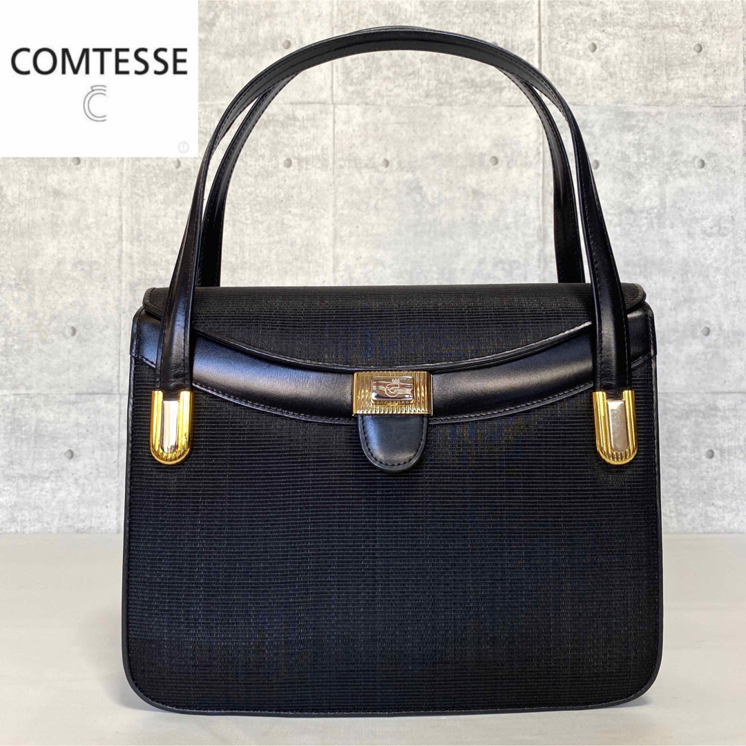 【良品】COMTESSE ホースヘア×レザー ブラック ロゴ入り金具ハンドバッグロイヤルブランド0910