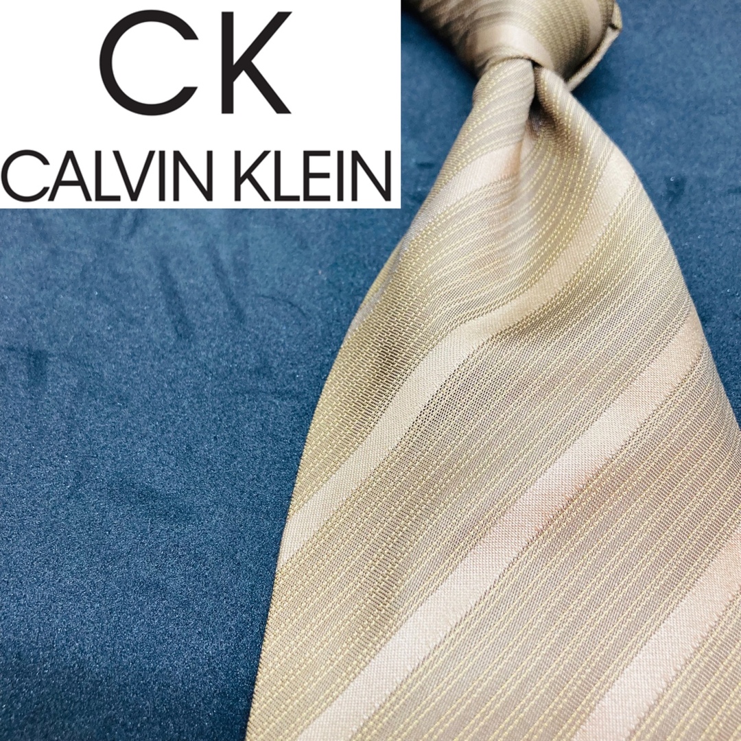 Calvin Klein(カルバンクライン)の【美品】CK/カルバンクライン　ネクタイ　ダークゴールド　総柄 メンズのファッション小物(ネクタイ)の商品写真