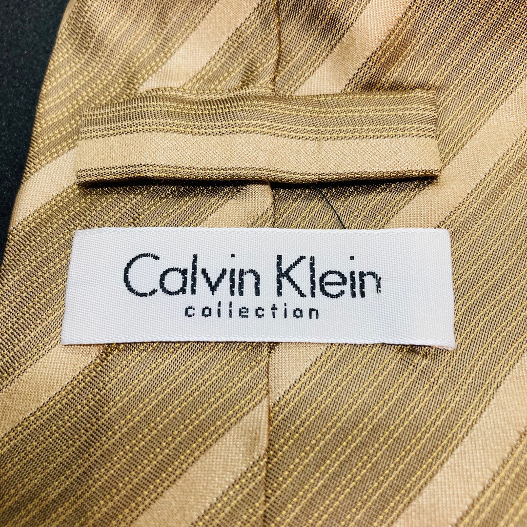 Calvin Klein(カルバンクライン)の【美品】CK/カルバンクライン　ネクタイ　ダークゴールド　総柄 メンズのファッション小物(ネクタイ)の商品写真