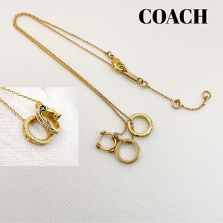 コーチ(COACH)のコーチ　ペンダント　3連リング　ラインストーン　ゴールド(ネックレス)