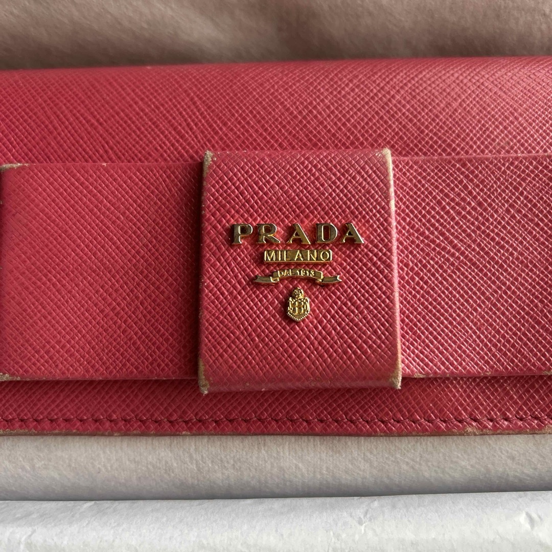 【PRADA】リボン 二つ折り長財布 赤 サフィアーノレザー ピンクレッド