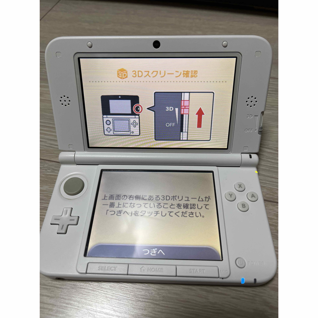 ニンテンドー3DS(ニンテンドー3DS)のNintendo3DS LLホワイト ACアダプタ付き オマケソフト付き エンタメ/ホビーのゲームソフト/ゲーム機本体(携帯用ゲーム機本体)の商品写真