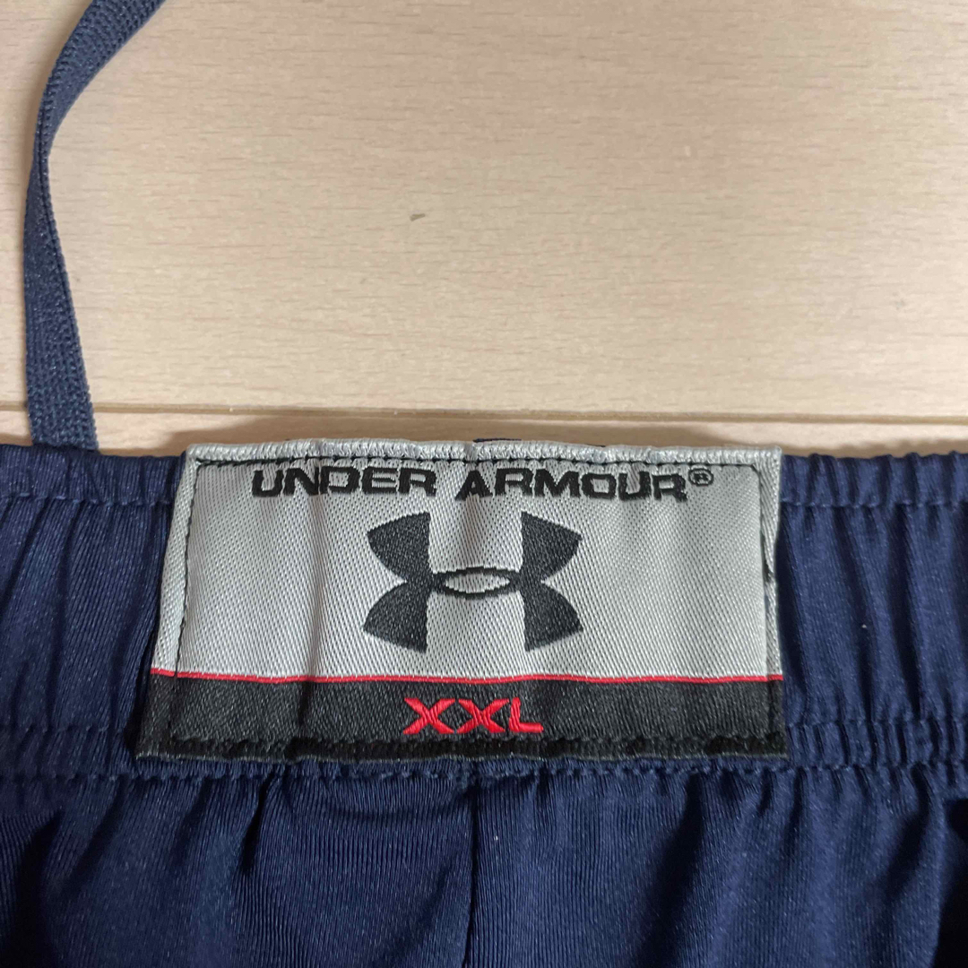 UNDER ARMOUR(アンダーアーマー)の法政大学“ORANGE“トレーニングハーフパンツ XXLサイズ【選手限定非売品】 スポーツ/アウトドアのスポーツ/アウトドア その他(アメリカンフットボール)の商品写真