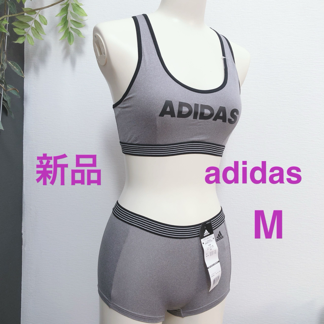 adidas(アディダス)の新品　M グレー　アディダス ブラ　ショーツ　ハーフトップ　スポーツブラ スポーツ/アウトドアのトレーニング/エクササイズ(トレーニング用品)の商品写真