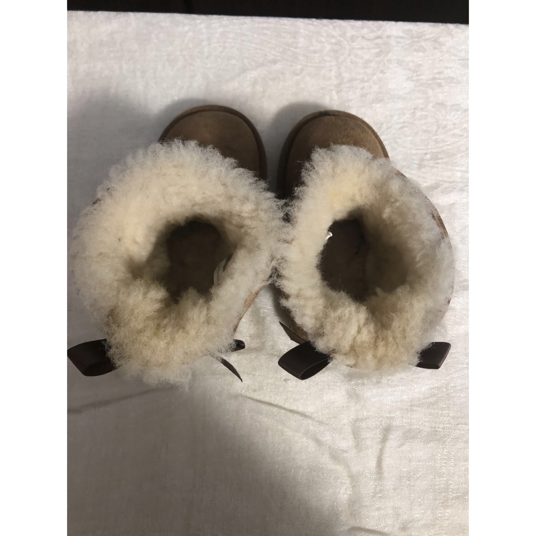 UGG(アグ)のUGG ムートンブーツ リボン 14.5cm キッズ/ベビー/マタニティのベビー靴/シューズ(~14cm)(ブーツ)の商品写真