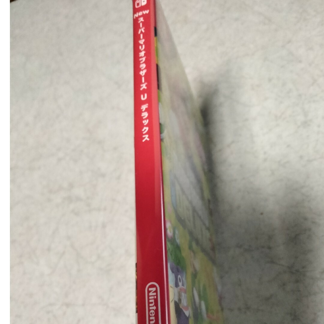 Nintendo Switch(ニンテンドースイッチ)のNew スーパーマリオブラザーズ U デラックス Switch週末お値下げ エンタメ/ホビーのゲームソフト/ゲーム機本体(家庭用ゲームソフト)の商品写真