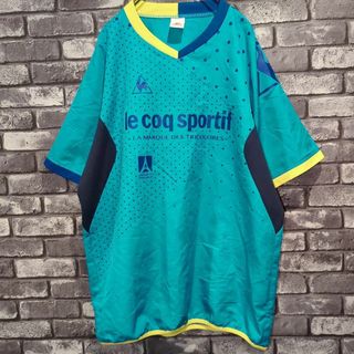 ルコックスポルティフ(le coq sportif)のデサント　サッカーウェア　ピステ半袖シャツ　ビッグロゴプリント　メンズL 古着(Tシャツ/カットソー(半袖/袖なし))